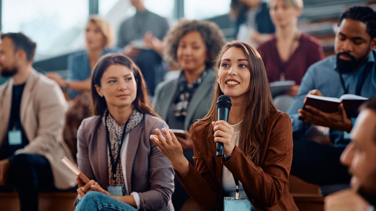 A woman speaking at a event