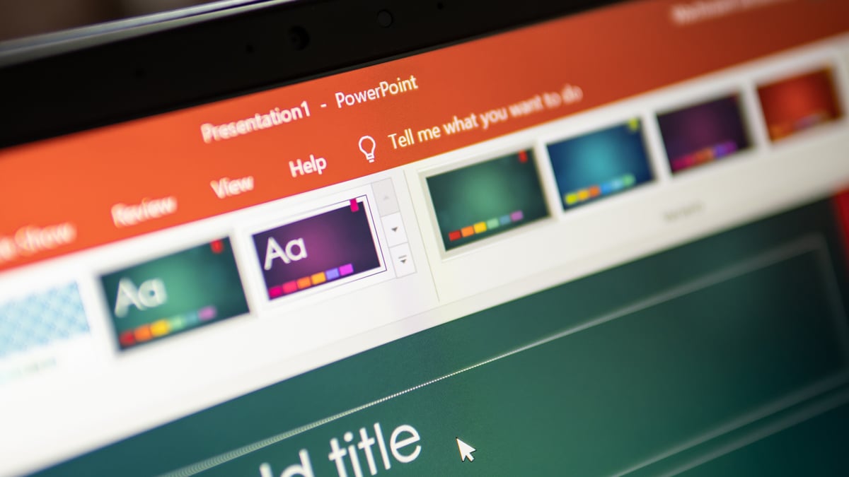 Interface showing user building a presentation using Microsoft PowerPoint